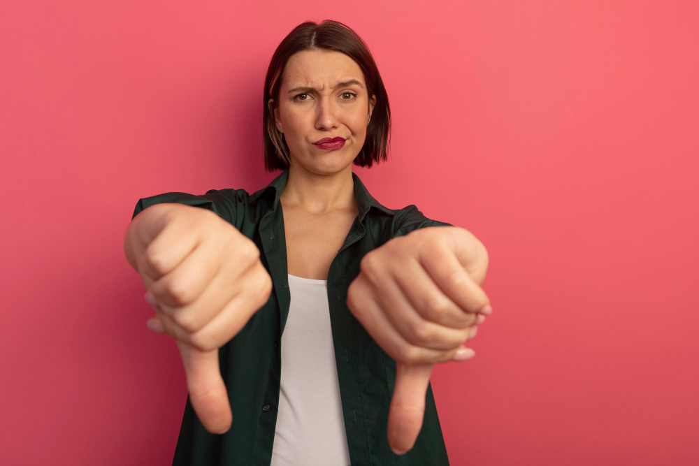 woman with thumbs down showing negative feedback